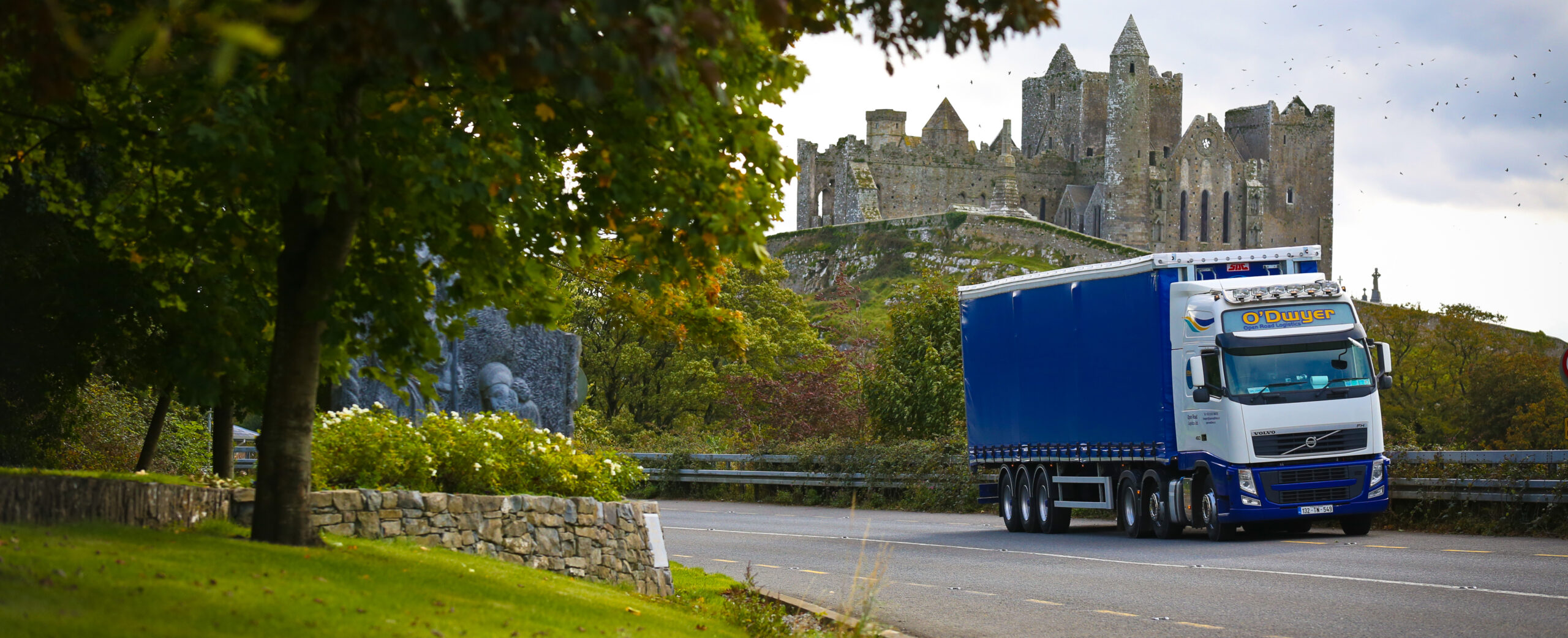 Truck in front of the rock of cashel